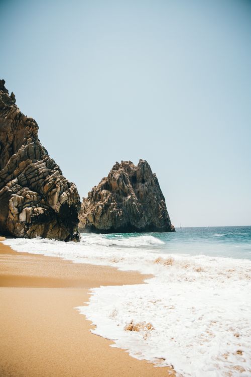 Free Explore the scenic beauty of Cabo San Lucas beach with striking rock formations and golden sand. Stock Photo