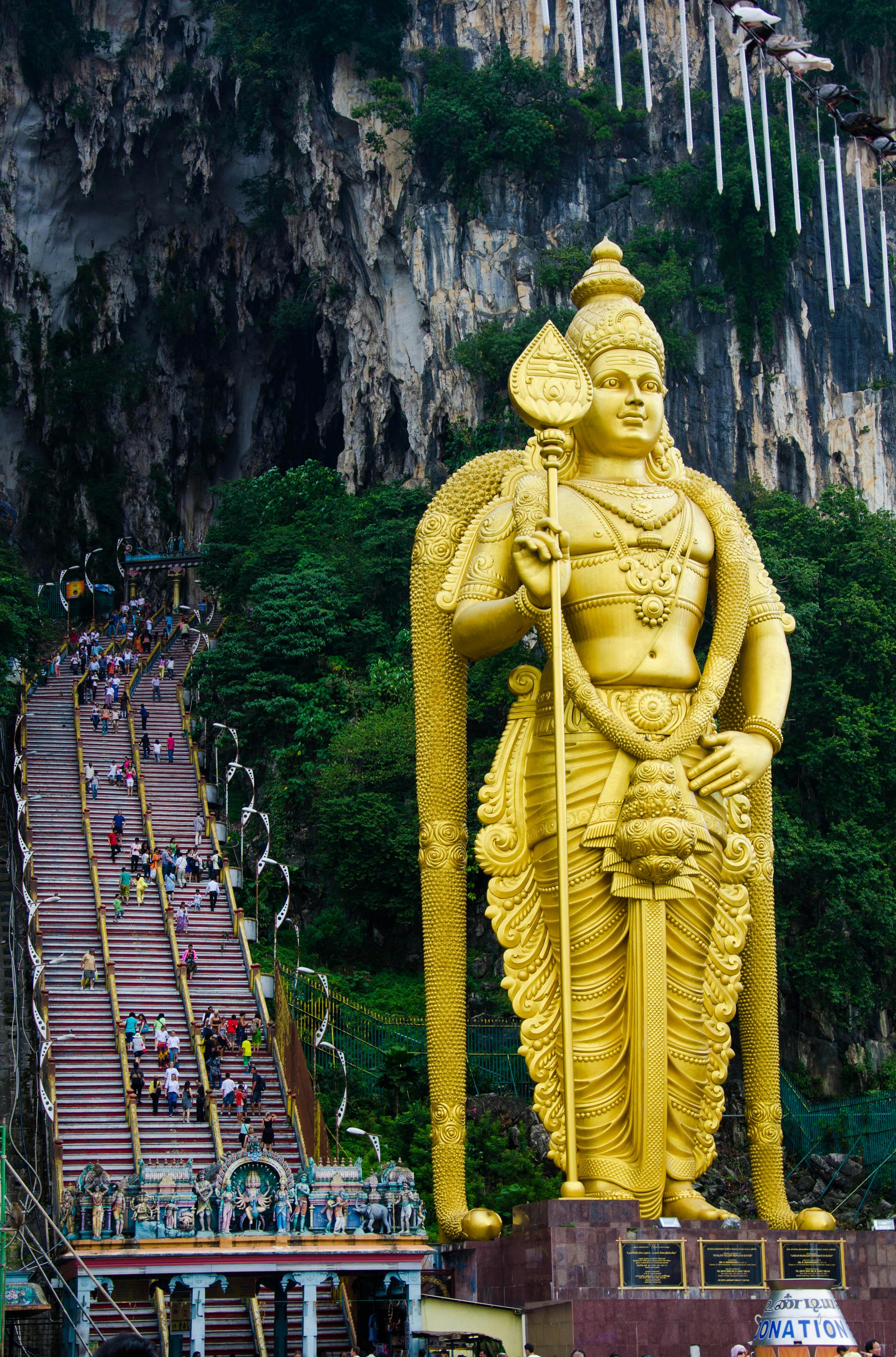 Download Lord Murugan 4k Surrounded By Temples Wallpaper | Wallpapers.com