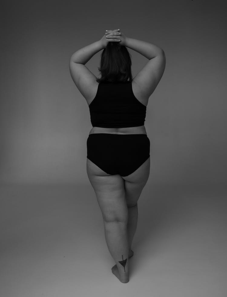 Black And White Studio Shot Of Womans Back