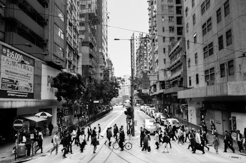 Grayscale Photo of People Walking on Street 