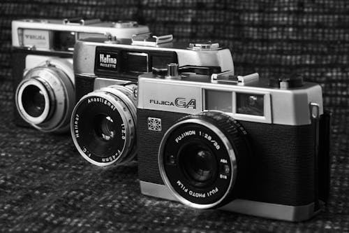 Grayscale Photo of Vintage Cameras
