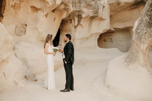 Bride and Groom in Tuff Stone Architecture