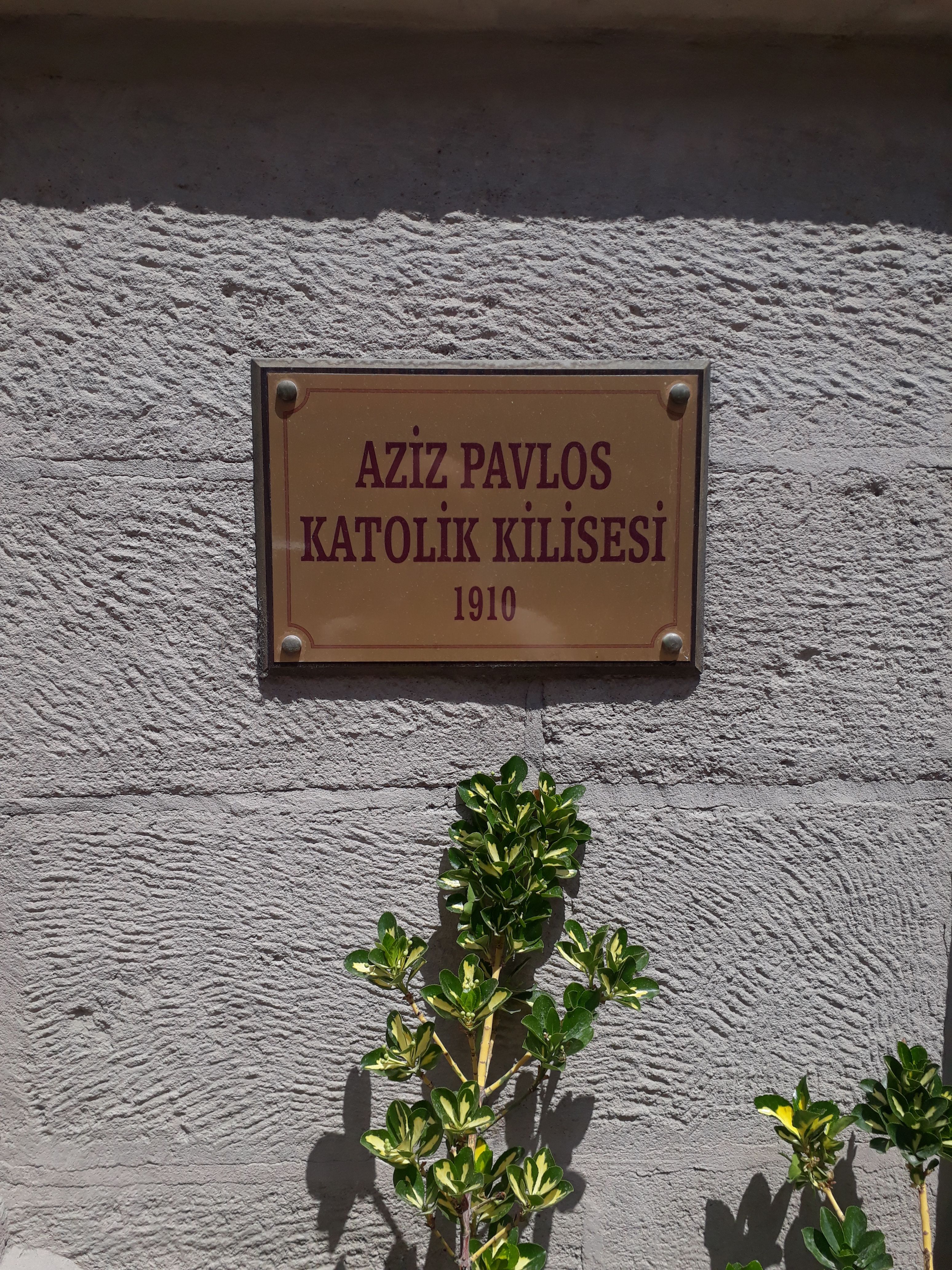 Plaque marking Aziz Pavlos Catholic Church in Meram, Konya, Turkey, established 1910.