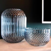 Pair of ribbed hand-blown glass vessels, photo by Kate Branch on Pexels