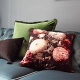 Patterned cushions arranged on a sofa, photo by Kate Branch on Pexels