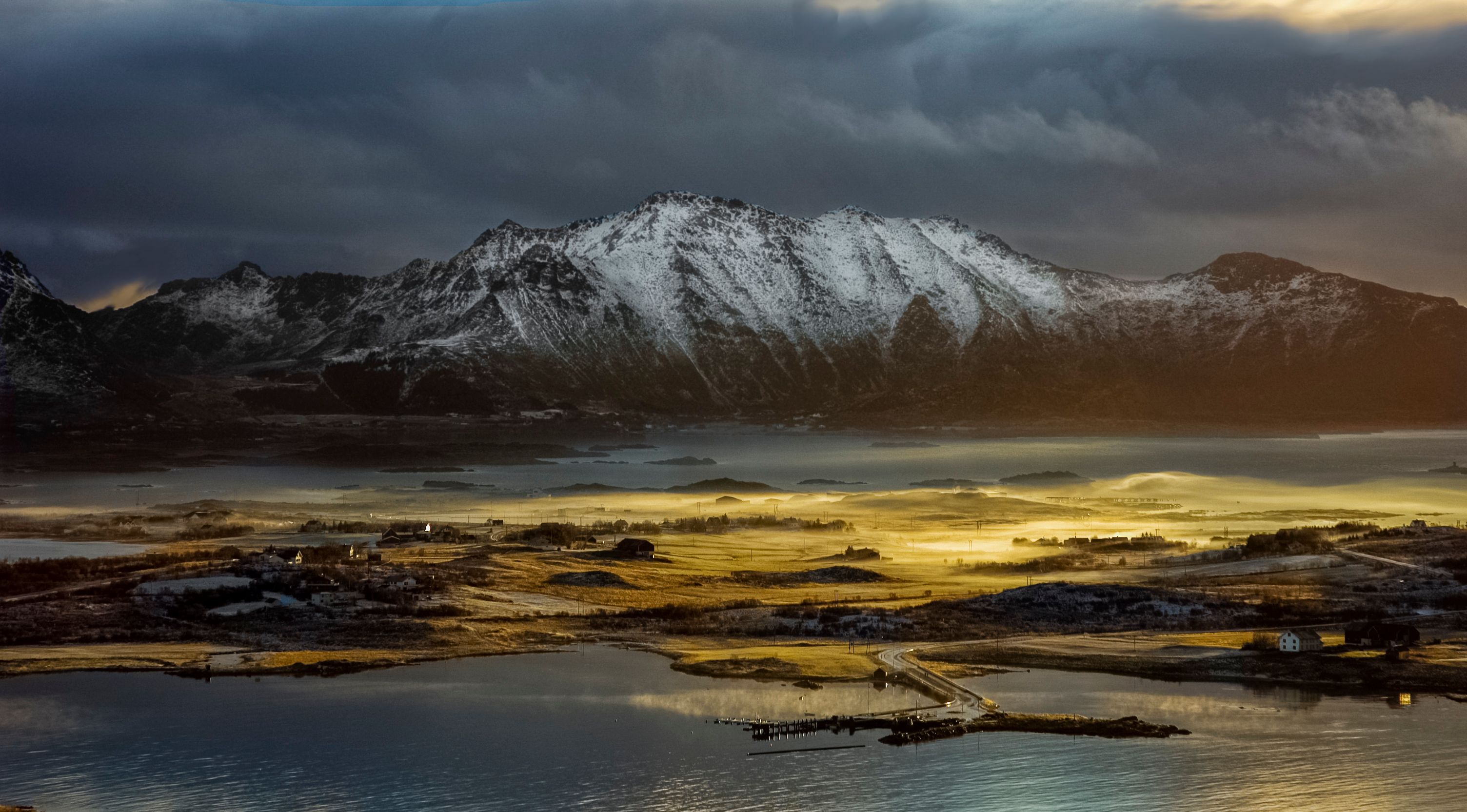 Stunning winter landscape with snow-covered mountains in Nordland, Norway, showcasing natural beauty.