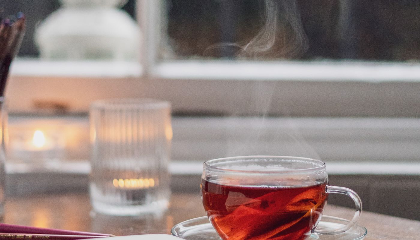 qingcha tea review — Clear Glass Teacup on the Table · Free. Photo: Pexels