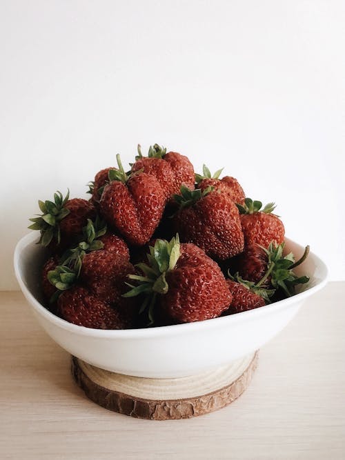 Red Strawberries in White Ceramic Bowl