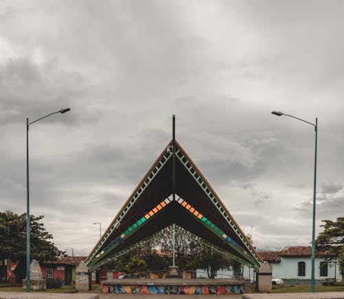 Brown and White Roof Under the Cloudy Sky