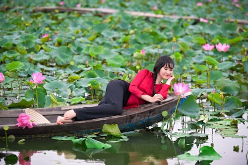 Free A Woman Lying on the Boat Stock Photo