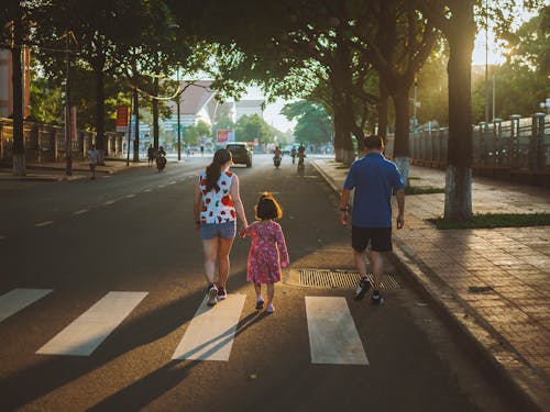 A Family Walking on the Street