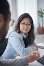 Woman in White Dress Shirt Wearing Black Framed Eyeglasses