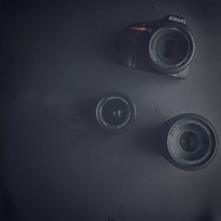 Camera And Lenses On A Flat Surface