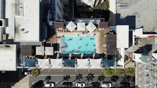 People Swimming in a Rooftop Pool