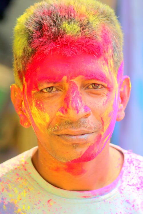 A Man With Pink Paint on His Face