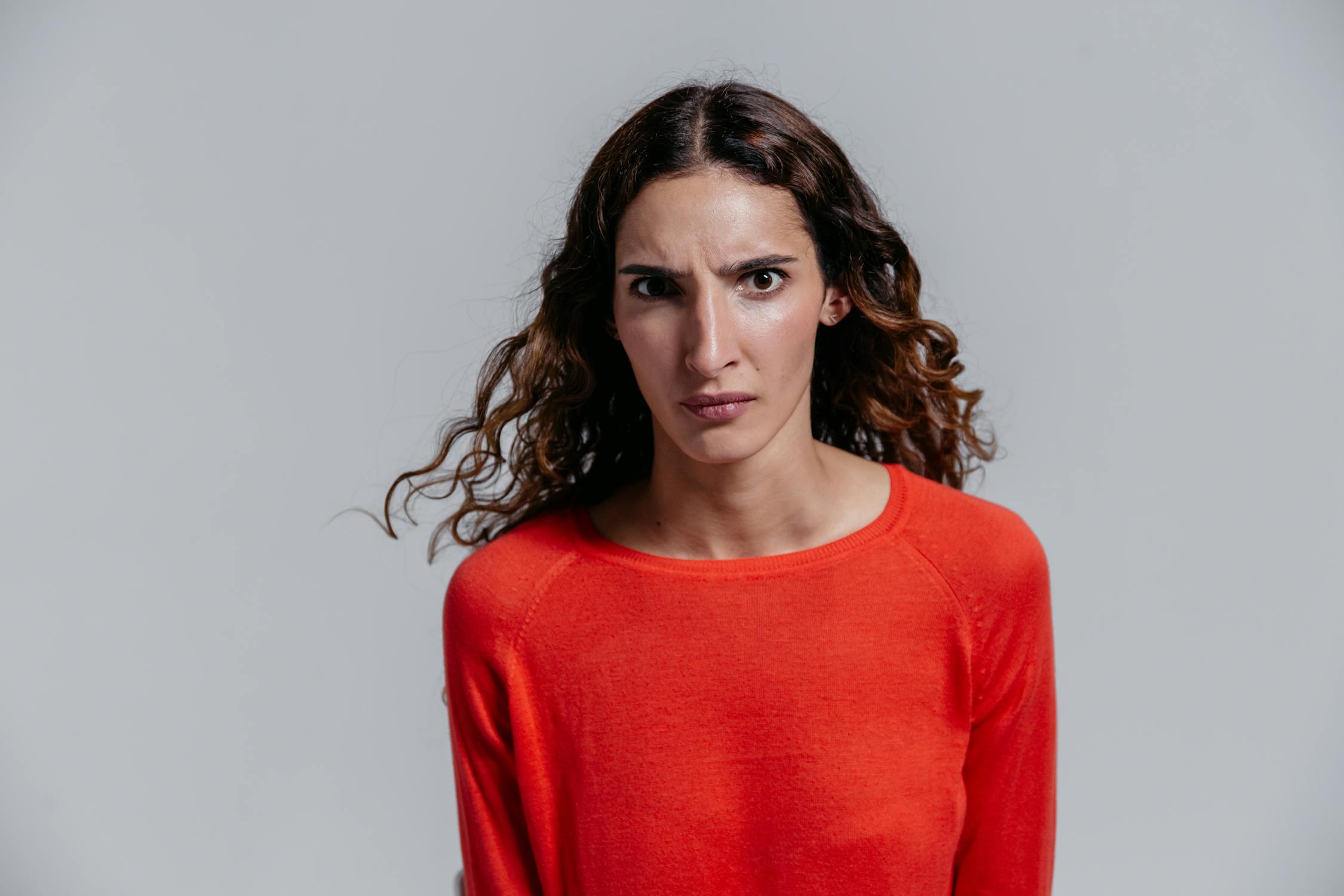A Woman in Red Long Sleeve Shirt