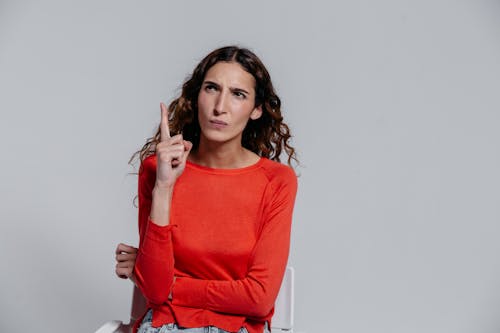 A Woman in Red Long Sleeve Shirt