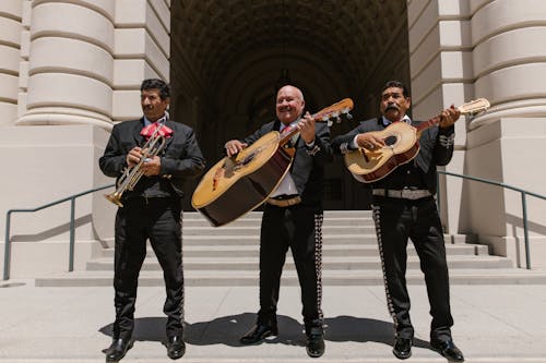 Free Three Mariachi Musicians in Traditional Outfits Stock Photo