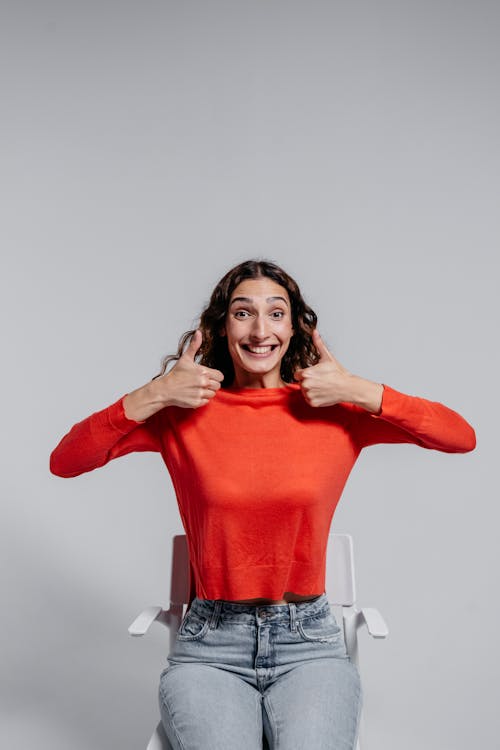 A Woman in Red Long Sleeve Shirt