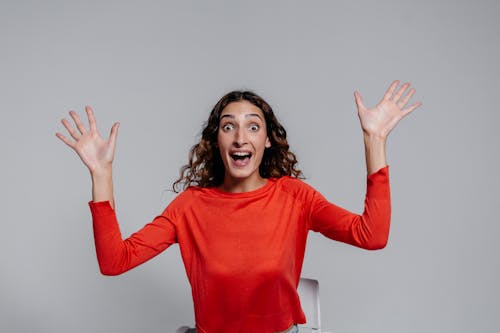 A Woman in Red Long Sleeve Shirt