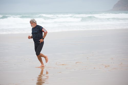A Man Running on the Shore