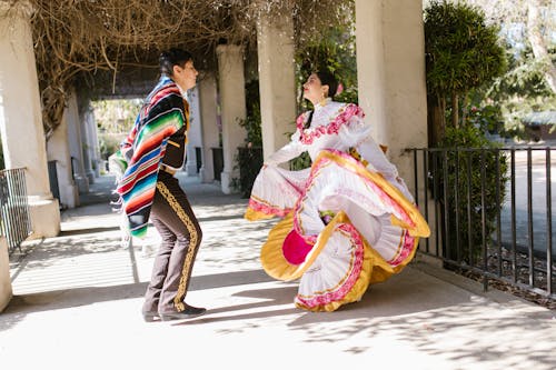 Man and Woman Doing a Traditional Dance 