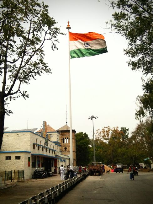 Indian flag waving high against urban backdrop in Neemuch, Madhya Pradesh, India