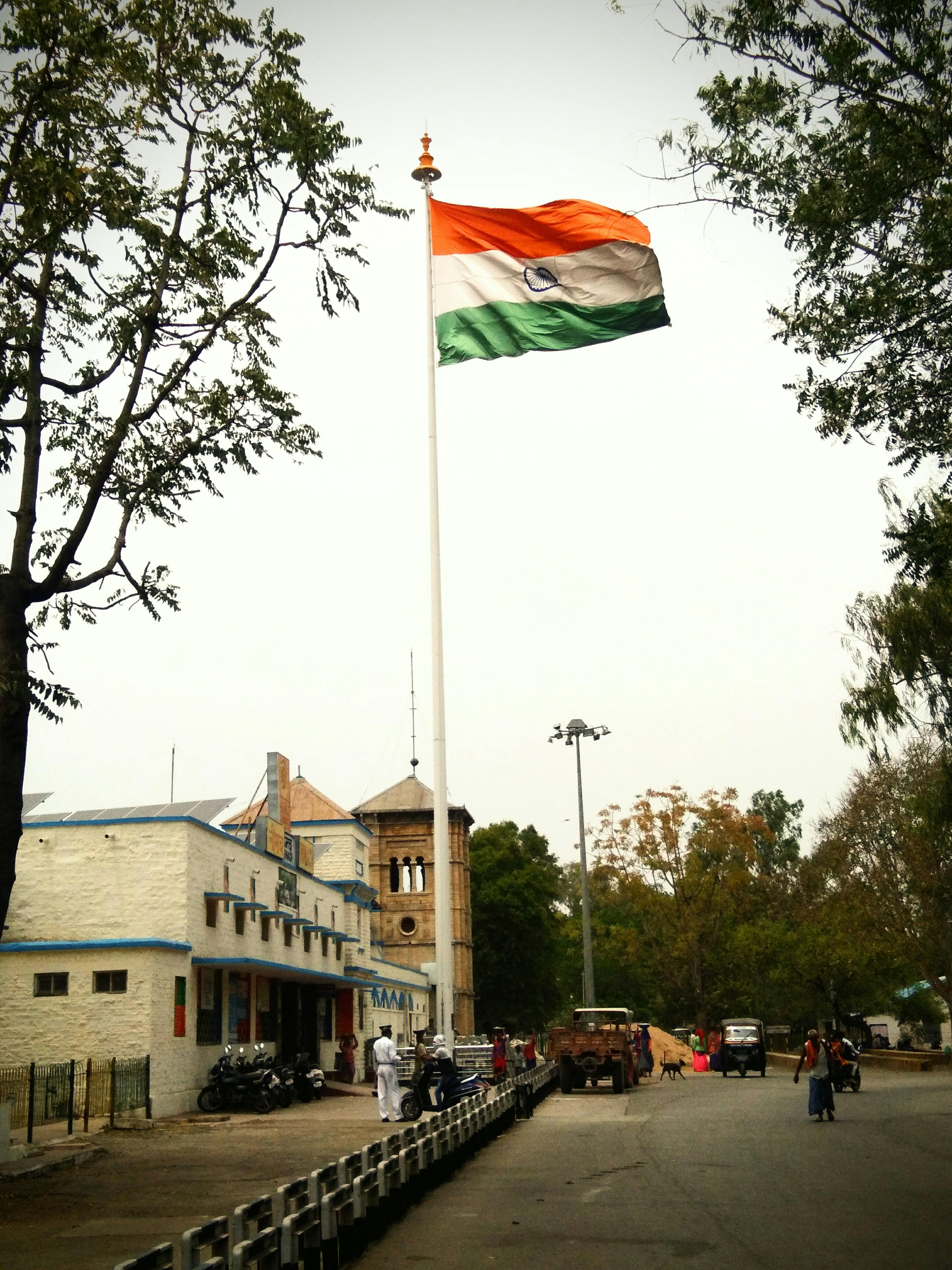 Indian Flag Swaying on a Flagpole on the Side of the Road · Free Stock ...