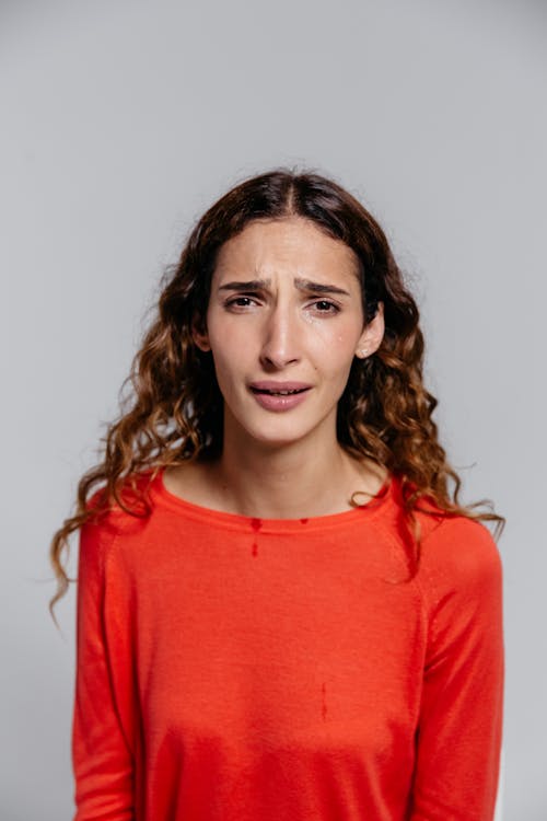 Woman in Red Crew Neck Shirt Crying