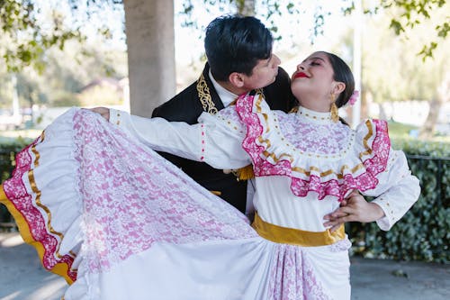 Man and Woman Dancing in Traditional Clothes 