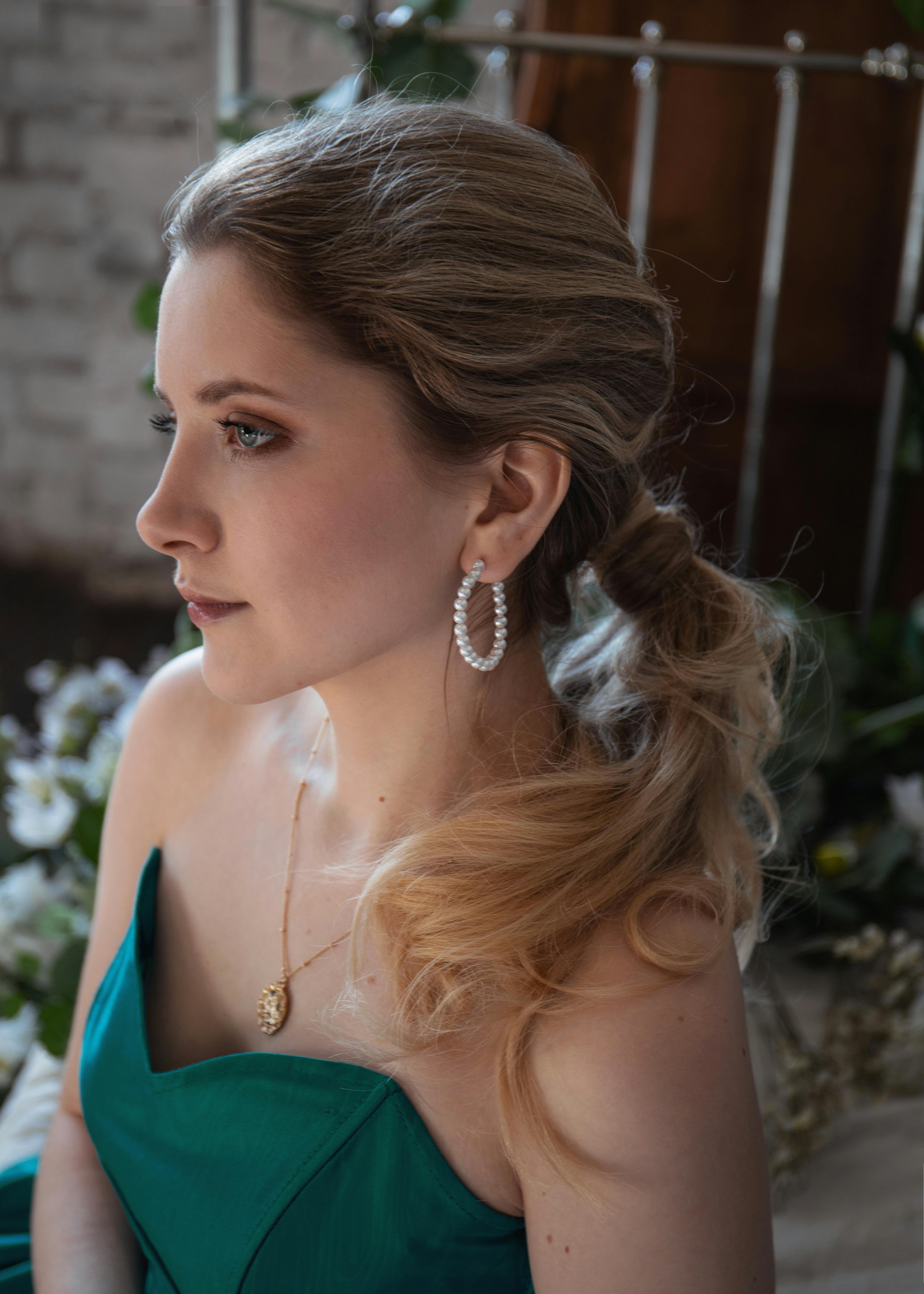 a portrait of a beautiful woman in green tube top dress