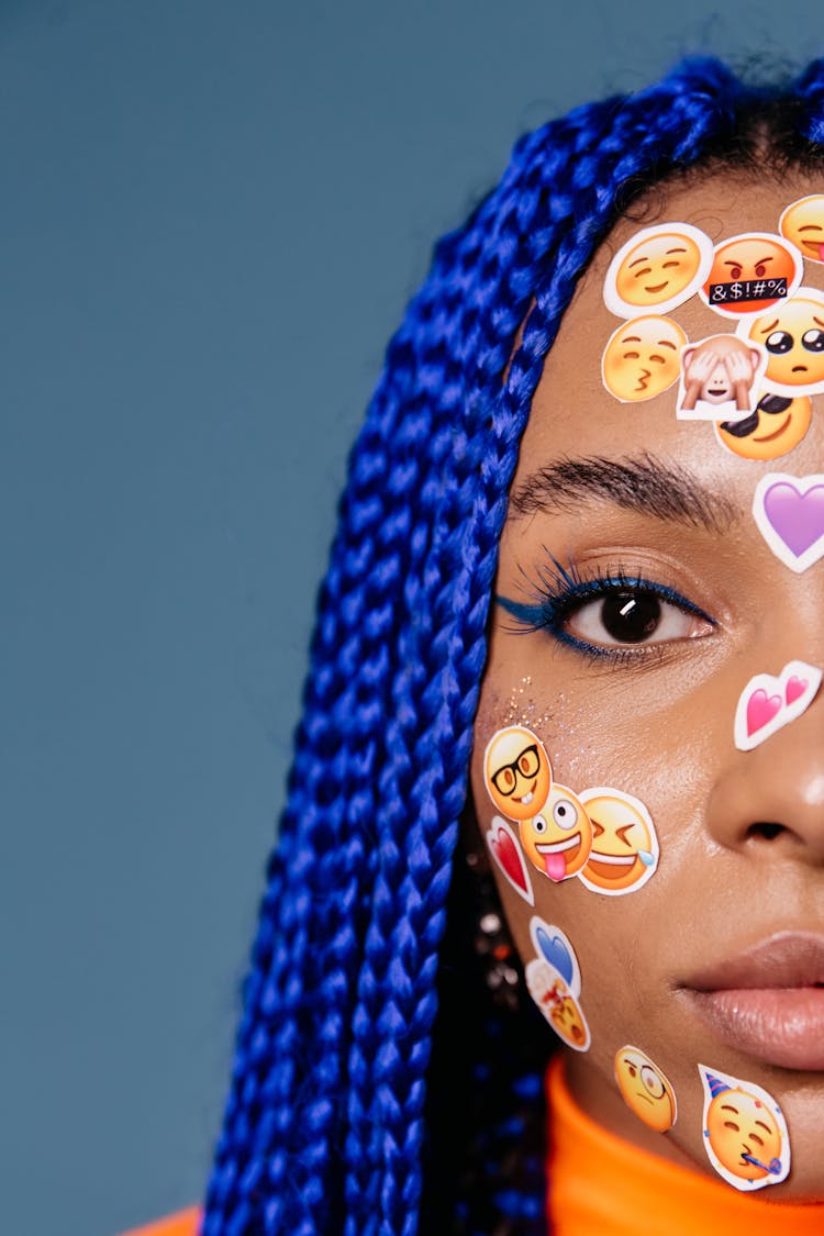 A Woman With Stickers On Her Face