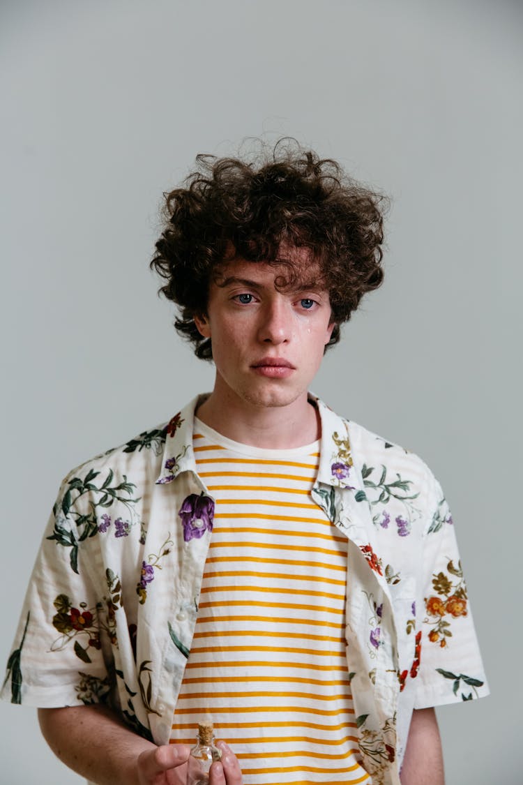 Photo Of A Man With Curly Hair Crying With Tears