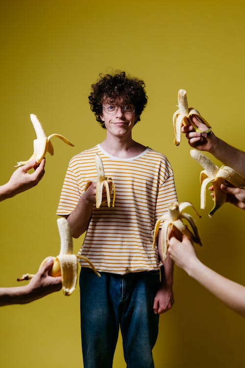 A Man Holding a Banana