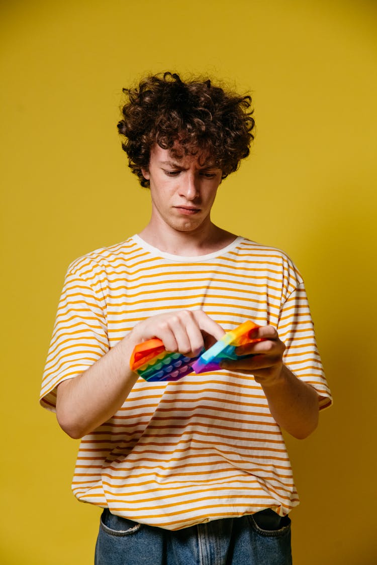 A Man Holding Toys