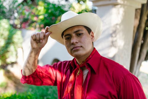 Free A Man Wearing a White Cowboy Hat Stock Photo