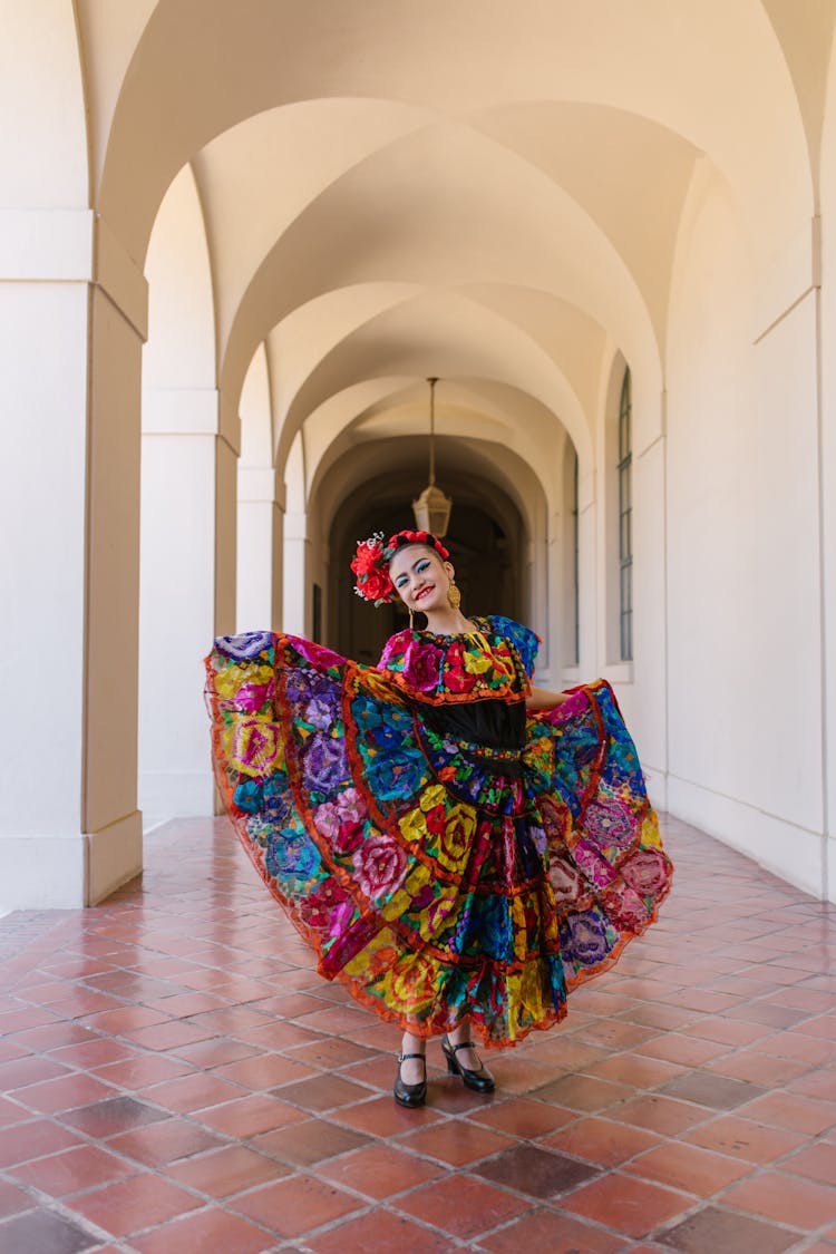 A Woman In Colorful Dress Standing On The Halway