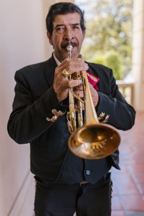 Free Man in Black Suit Playing Trumpet Stock Photo