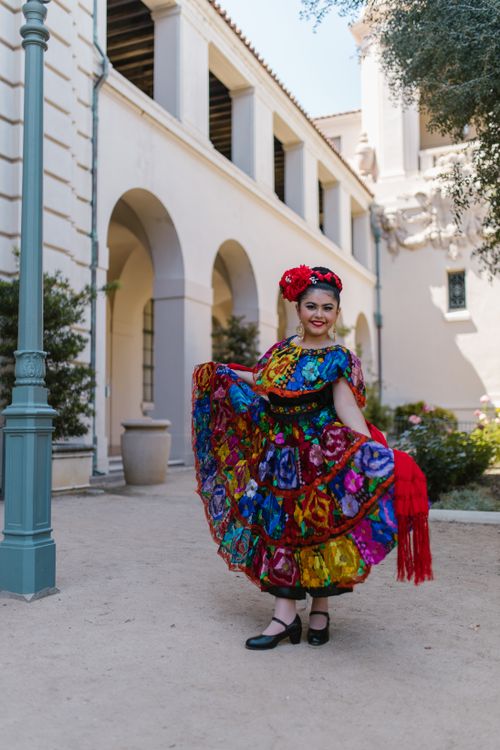 Free Vibrant traditional Mexican dress worn during a fiesta, showcasing cultural heritage outdoor setting. Stock Photo