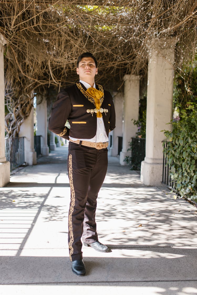 Man In Traditional Clothing Standing And Looking Proud