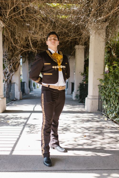 Free Proud man in traditional Mexican mariachi clothing standing outdoors. Stock Photo