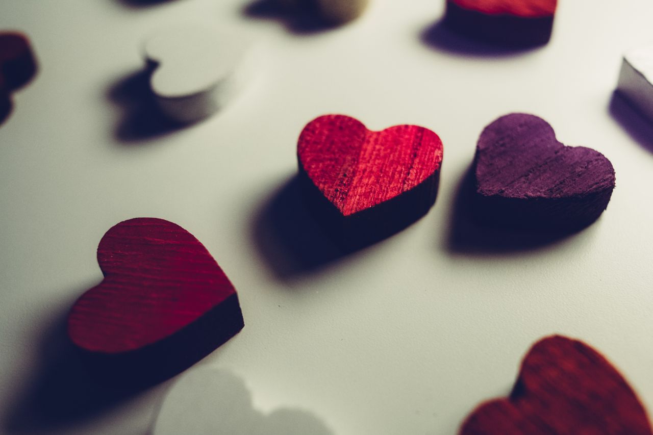 vibrant wooden heart shapes in red and purple perfect for valentine s