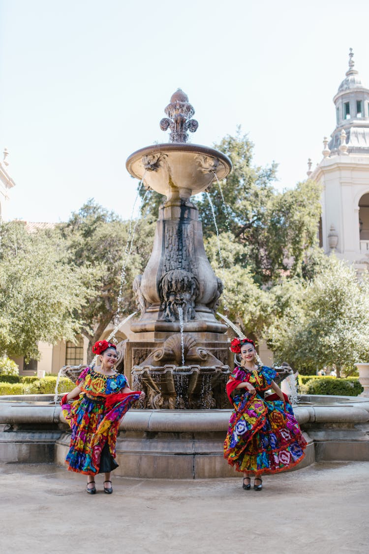 Women In Dancing Near A Fountain