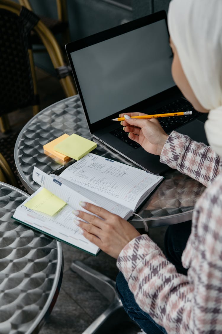 A Woman Writing At The Table