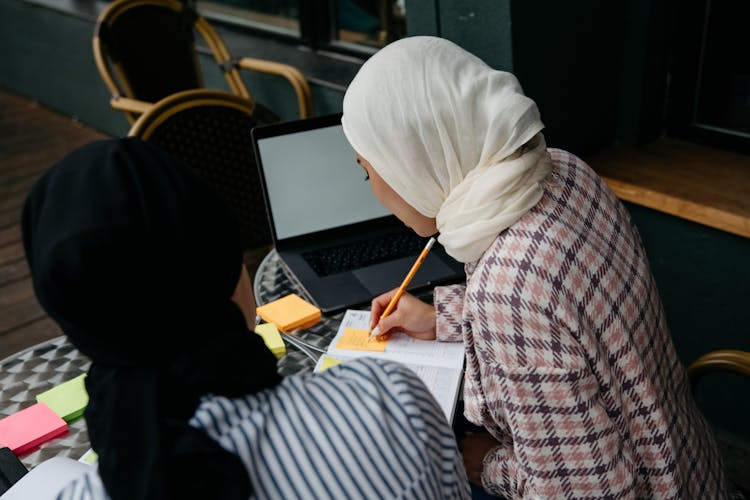 A Woman Writing At The Table