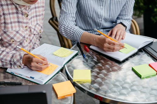 Women Writing on Sticky Notes