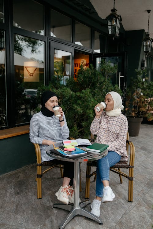 Free Women Drinking Coffee at a Café  Stock Photo