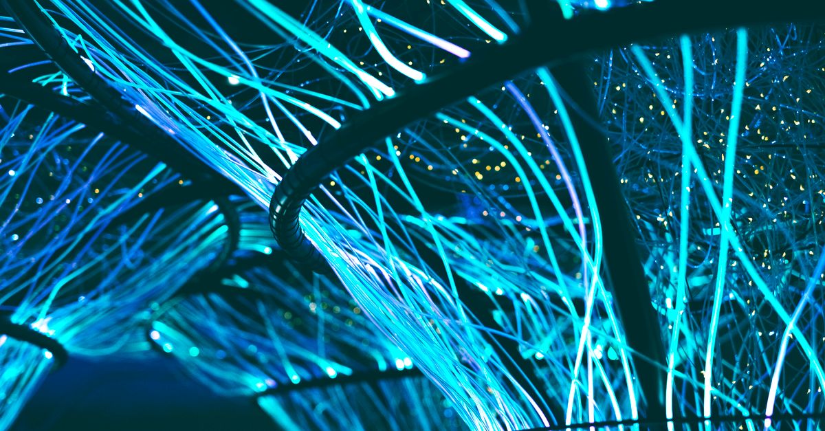 Photo by Georgie Devlin A mesmerizing display of glowing neon blue optical fibers creating a futuristic atmosphere.