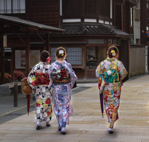 A Group of Women Wearing Traditional Kimonos During Festival in Japan