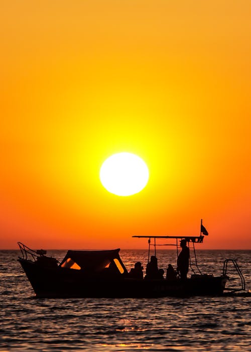 Silhouette of Boat during Sunset